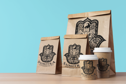 mockup-of-three-food-paper-bags-and-two-paper-cups-placed-on-a-wooden-table-m29051-r-el2
